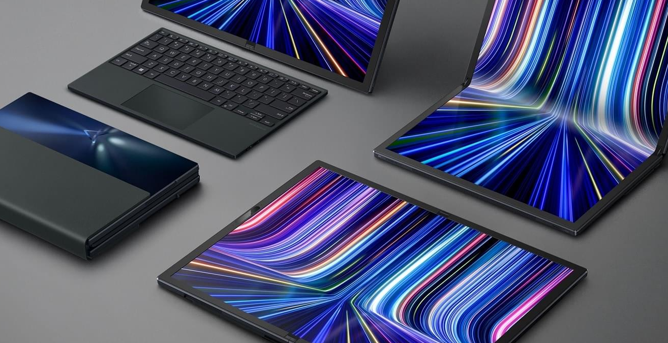 Four units of ASUS Zenbook 17 Fold OLED, with one completely unfolded on the surface