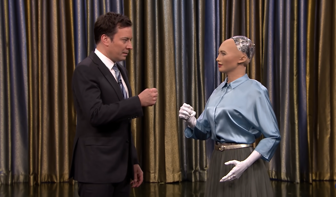 Humanoid robot Sophia playing rock-paper-scissors with the host at The Tonight Show Starring Jimmy Fallon