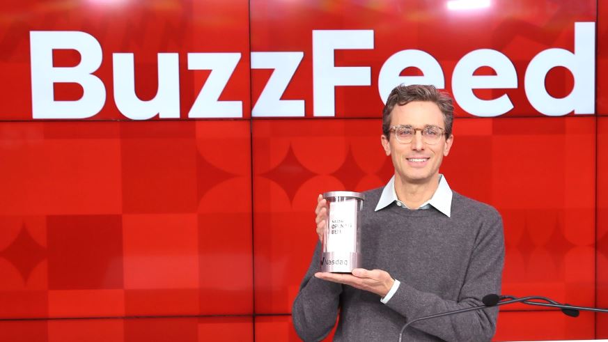 Jonah Peretti, CEO of Buzzfeed, shows something on his hand