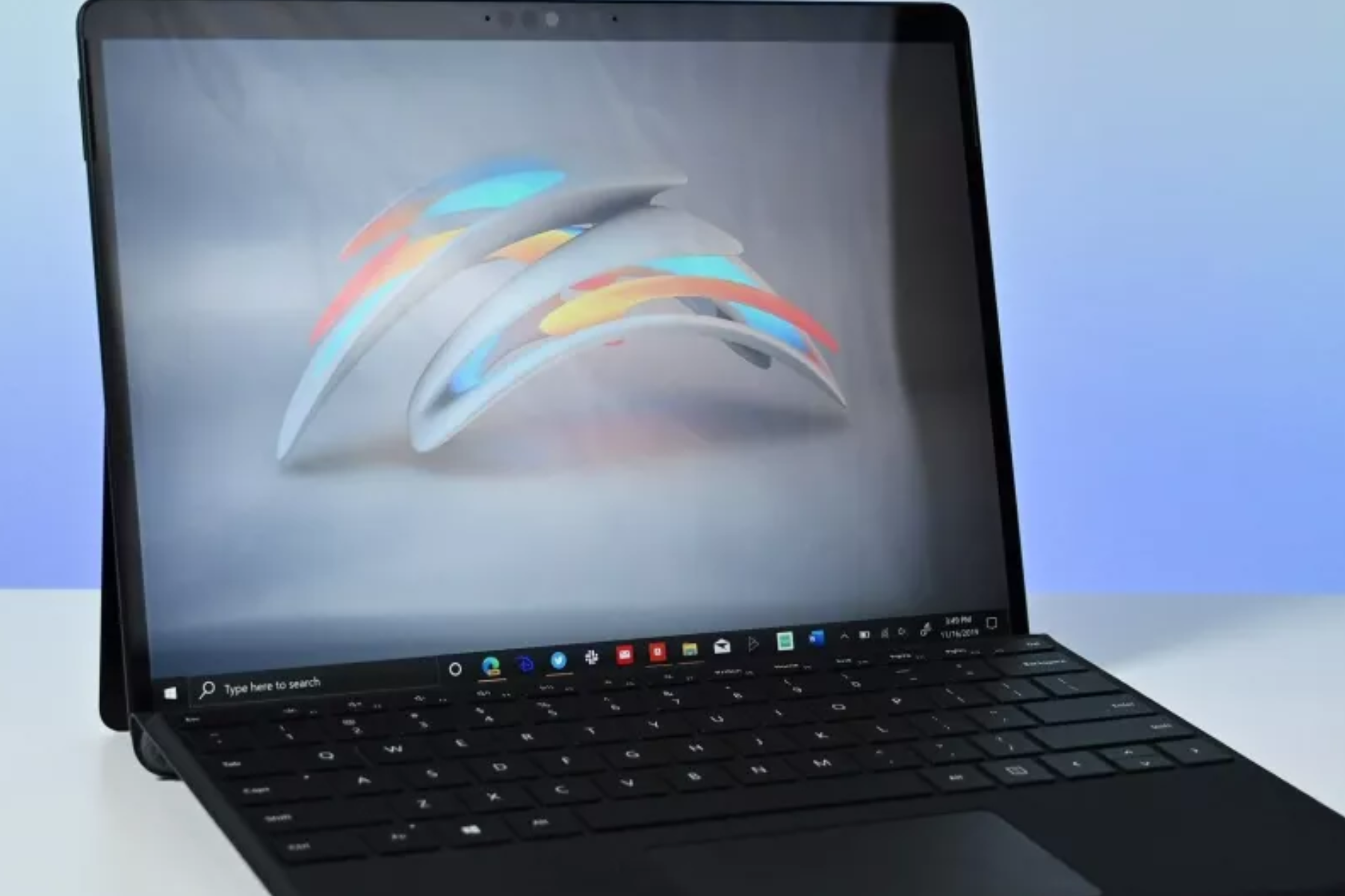 A black laptop with a futuristic wallpaper