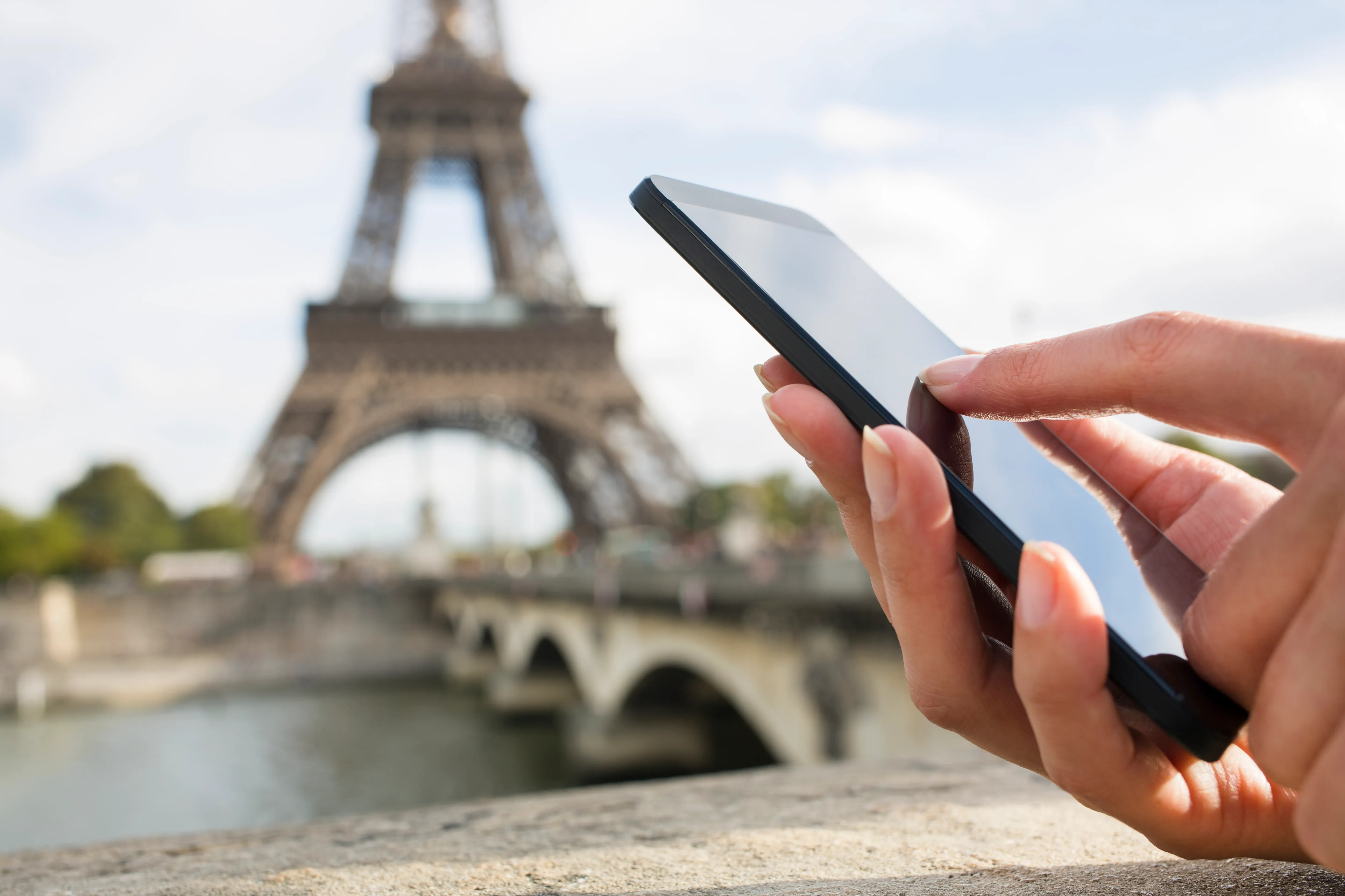 Tourist translating with an app in paris